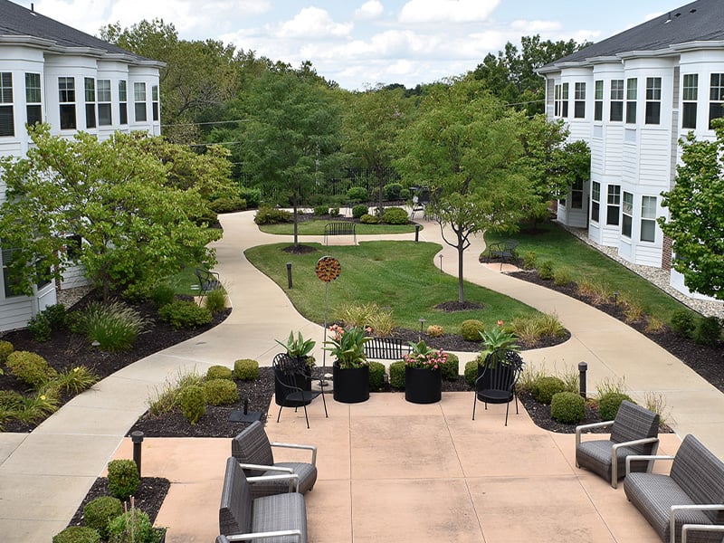 An aerial perspective showcasing the full Cedarhurst of Des Peres community, highlighting our beautiful building and inviting courtyards