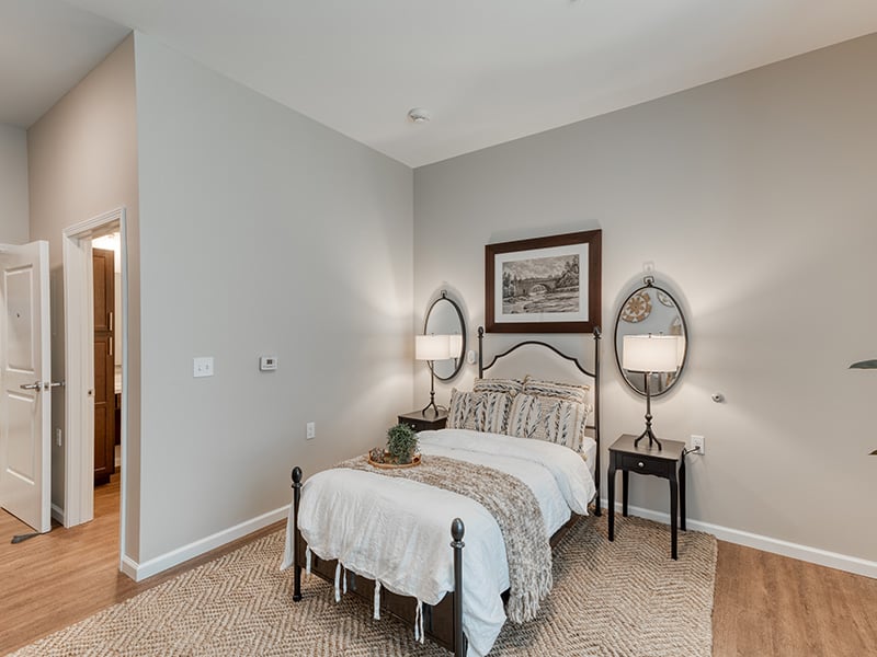 Cedarhurst of Dyer: A cozy and well-appointed senior apartment bedroom for residents