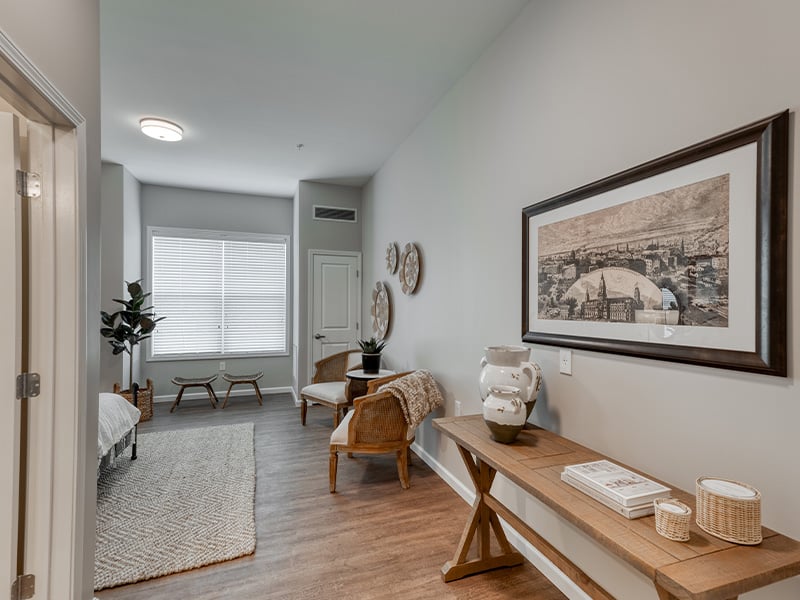 Senior-friendly apartment living room at Cedarhurst of Dyer, offering comfortable and accessible design for residents