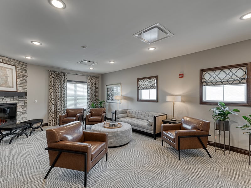 Cedarhurst of Dyer's welcoming common area, complete with comfortable furniture and a warm fireplace for relaxation and socialization