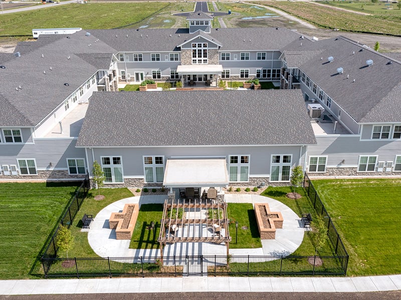An aerial perspective showcasing the full Cedarhurst of Dyer community, highlighting our beautiful building and inviting courtyards