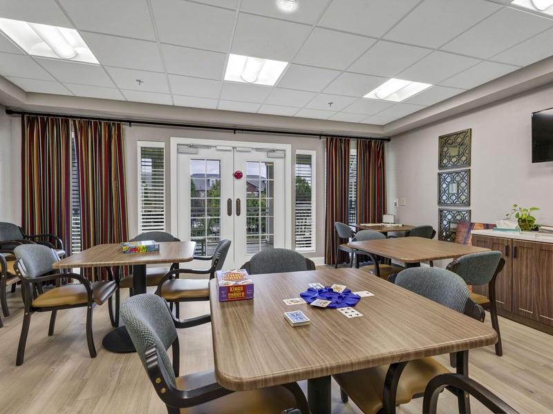 Residents at Cedarhurst of East Louisville senior living community enjoy a dedicated art and activity room, offering an accessible space for hobbies, crafts, and games