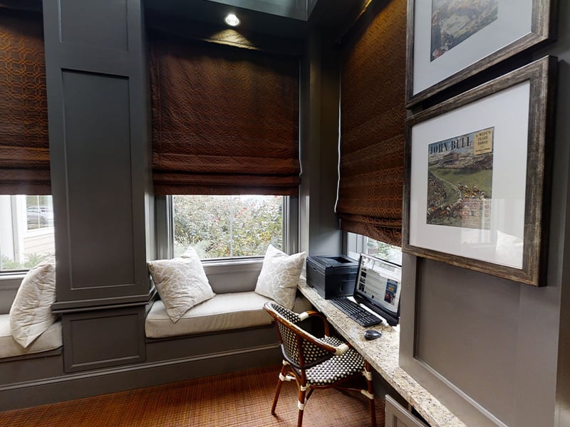 Cedarhurst of East Louisville's welcoming senior-friendly common area with accessible resources for reading and relaxation