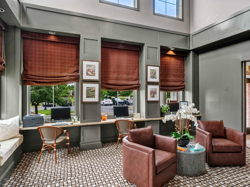 Cedarhurst of East Louisville's welcoming senior-friendly common area with accessible resources for reading and relaxation