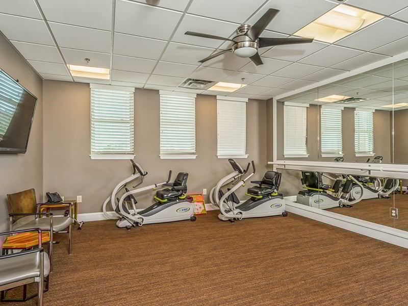 The dedicated physical therapy room at Cedarhurst of East Louisville, equipped with accessible equipment for resident rehabilitation and wellness