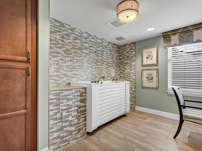 Spa room with a walk-in tub at Cedarhurst of East Louisville senior living community