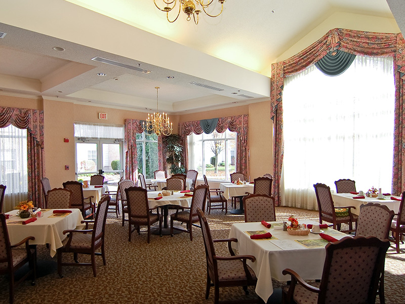 Elegant dining space at Cedarhurst of Edison Lakes, offering comfortable, accessible seating for resident meals