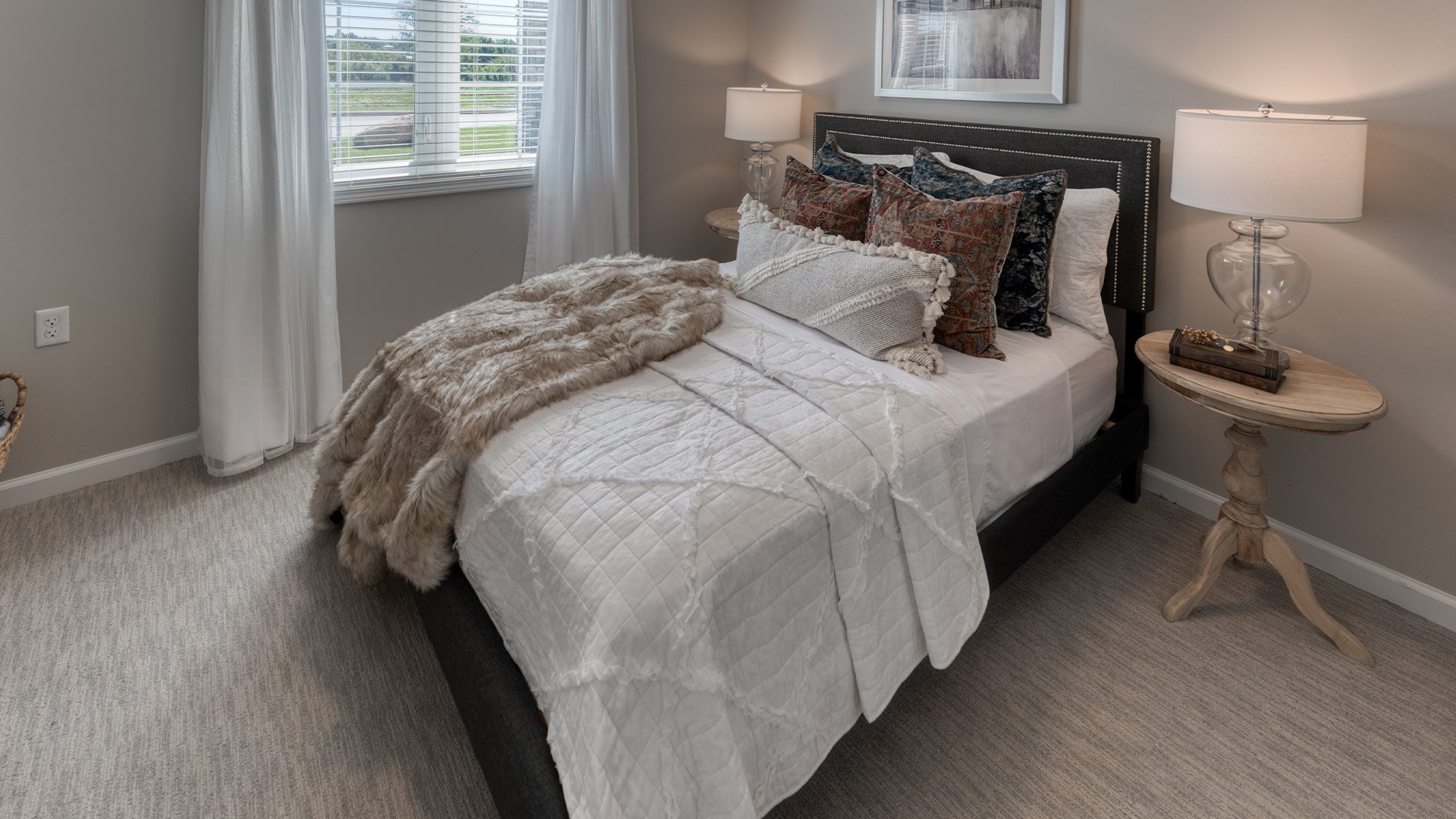 Bedroom of a senior apartment at Cedarhurst of Farmington, designed for resident comfort and personalization