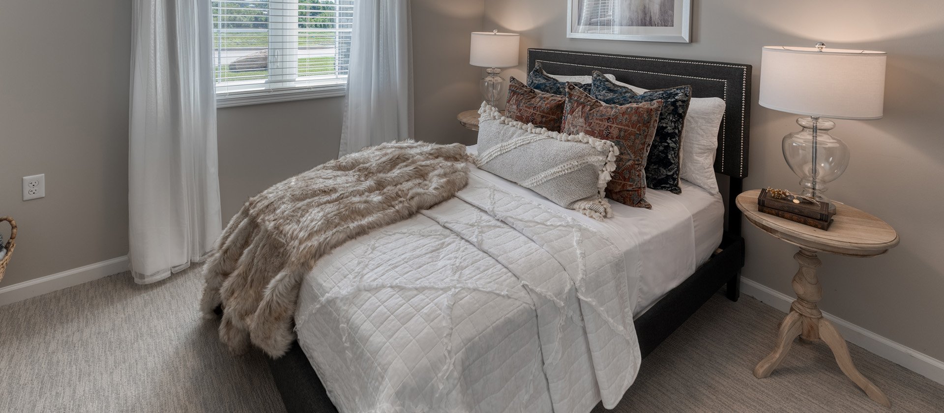 Bedroom of a senior apartment at Cedarhurst of Farmington, designed for resident comfort and personalization