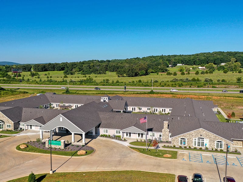 Aerial view of the entire Cedarhurst of Farmington senior living community's building and grounds