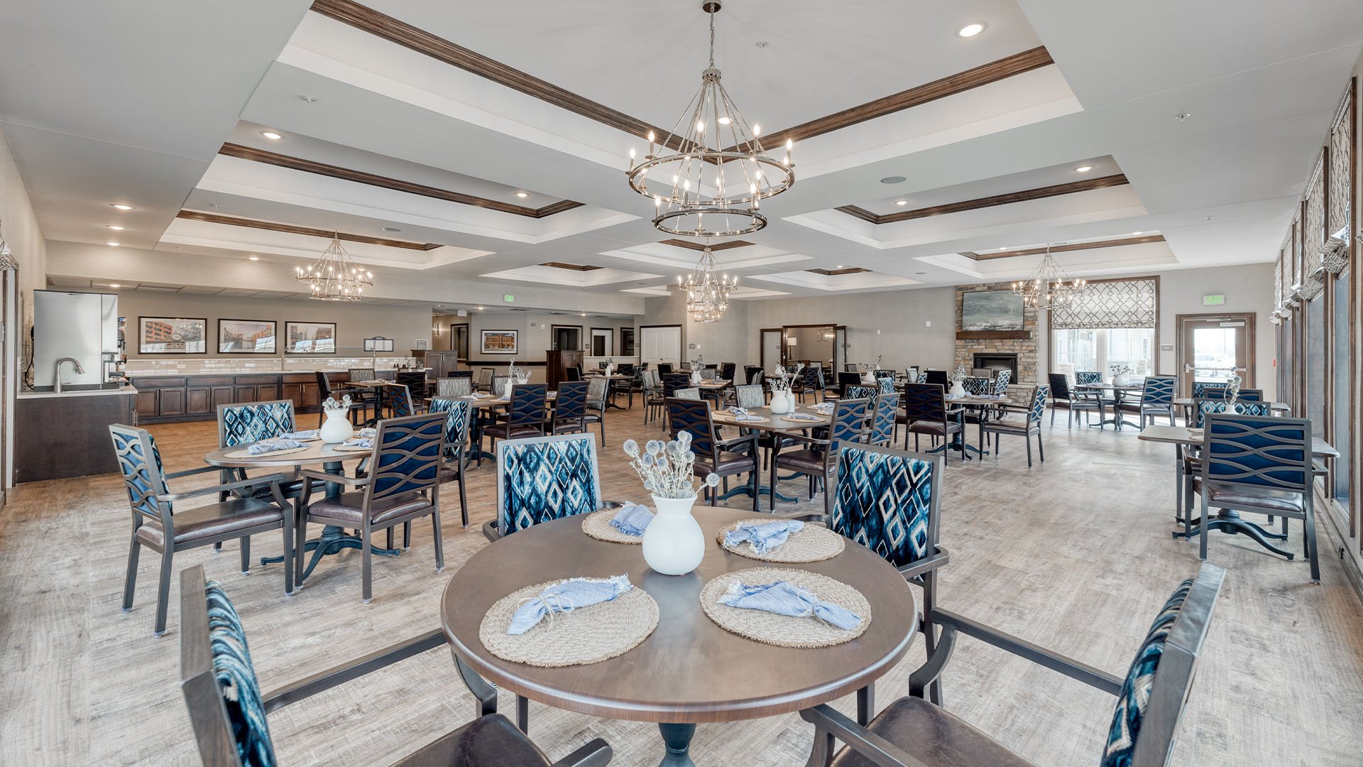 A spacious and bright dining room at Cedarhurst of Fort Wayne, offering comfortable seating for meals