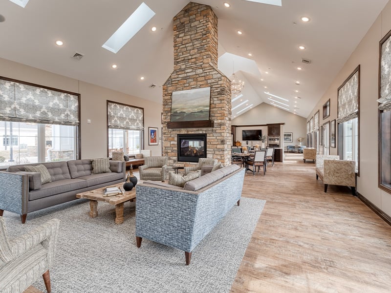 Cedarhurst of Fort Wayne's welcoming common area, complete with comfortable furniture and a warm fireplace for relaxation and socialization