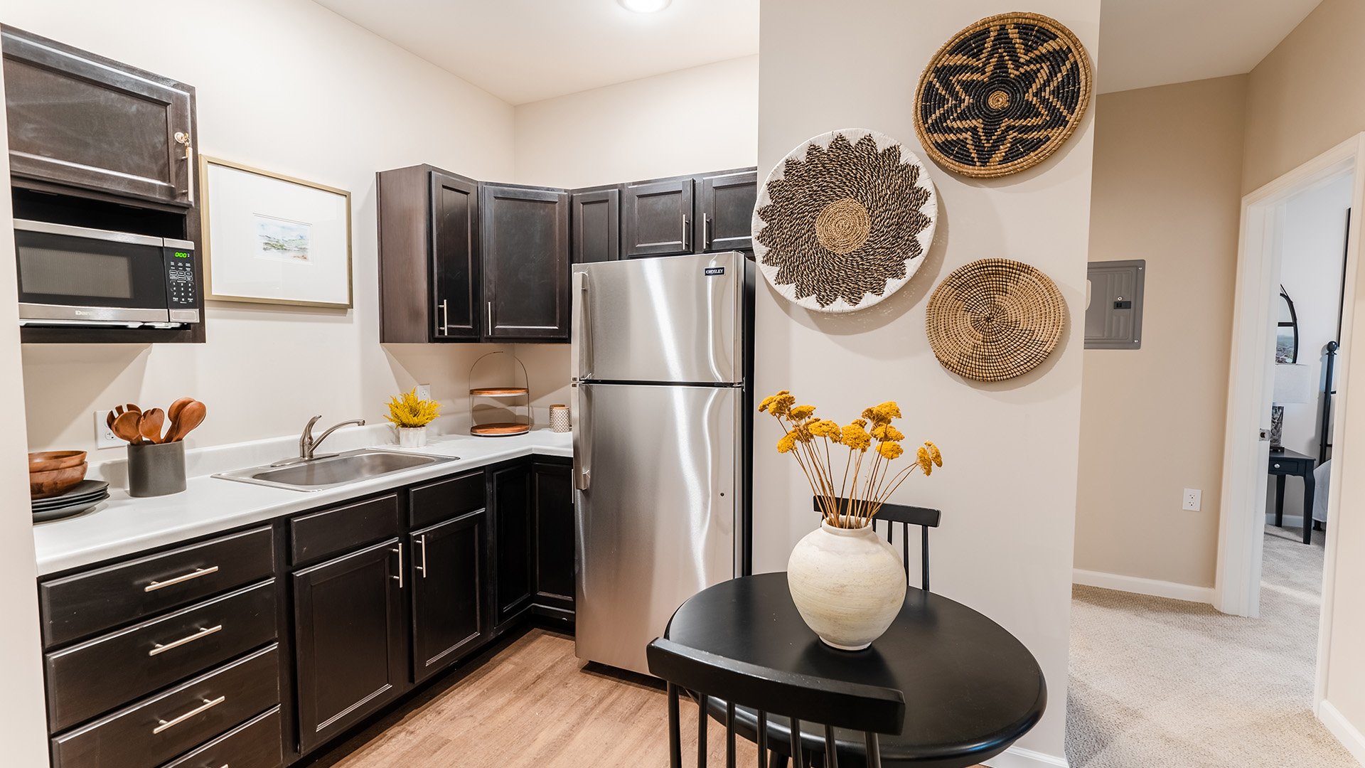 An accessible kitchenette in a senior apartment at Cedarhurst of Frankfort, designed for ease of use and independence.
