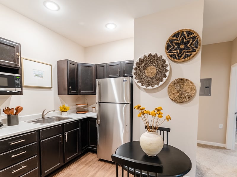 An accessible kitchenette in a senior apartment at Cedarhurst of Frankfort, designed for ease of use and independence