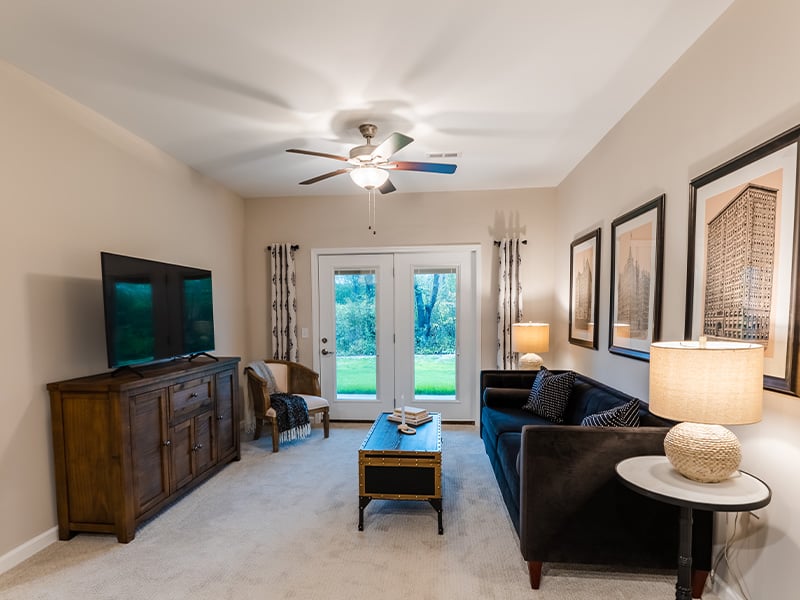 Senior-friendly apartment living room at Cedarhurst of Frankfort, offering comfortable and accessible design for residents