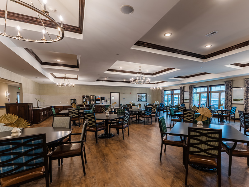 Another elegant dining space at Cedarhurst of Frankfort, offering comfortable, accessible seating for resident meals.