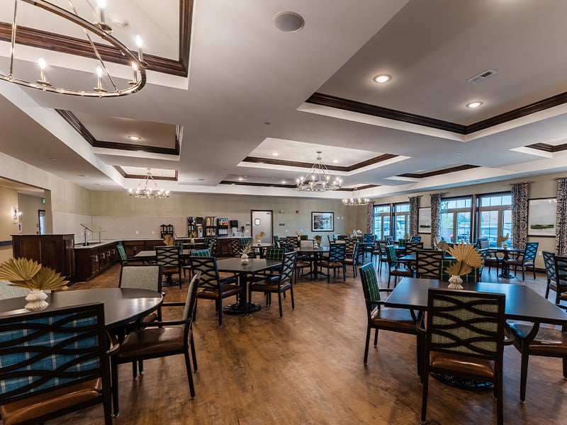 Another elegant dining space at Cedarhurst of Frankfort, offering comfortable, accessible seating for resident meals.