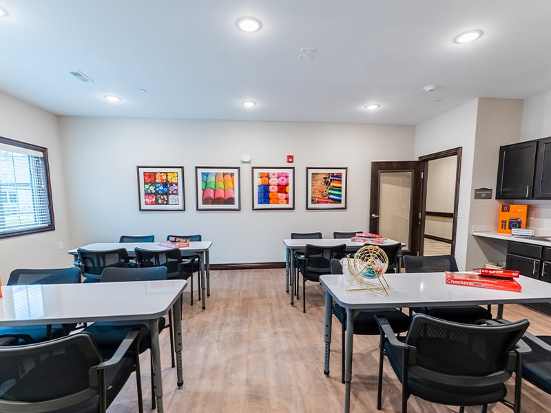 A bright and welcoming activity room at Cedarhurst of Frankfort, offering various opportunities for recreation