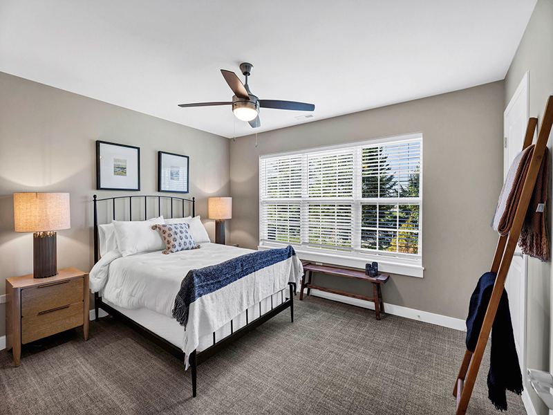Bright and spacious bedroom in Cedarhurst of Frankfort's Independent Living at Cedarhurst Cottages, featuring walk-in closet