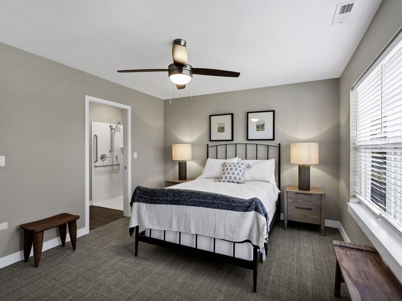 View from the bedroom toward an attached bathroom in Cedarhurst of Frankfort's Independent Living at Cedarhurst Cottages