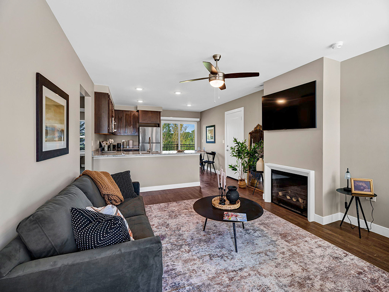 Open-concept living room and kitchen inside of Cedarhurst of Frankfort's Independent Living at Cedarhurst Cottages