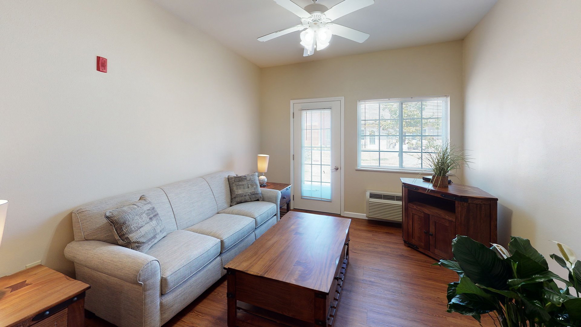 Senior-friendly apartment living room at Cedarhurst of Highland, offering comfortable and accessible design for residents
