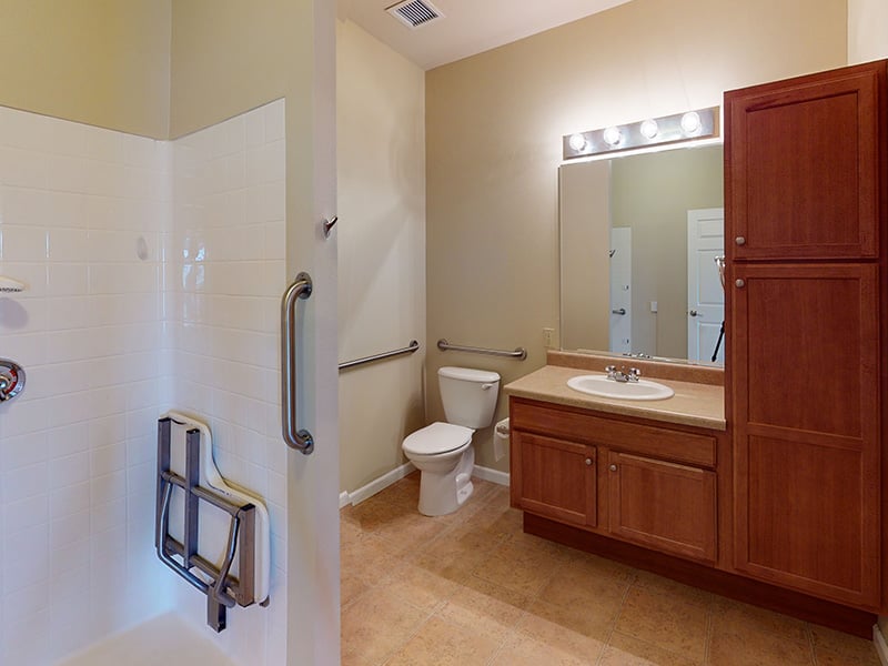 Bathroom of a senior apartment at Cedarhurst of Highland, built with accessibility features to support residents