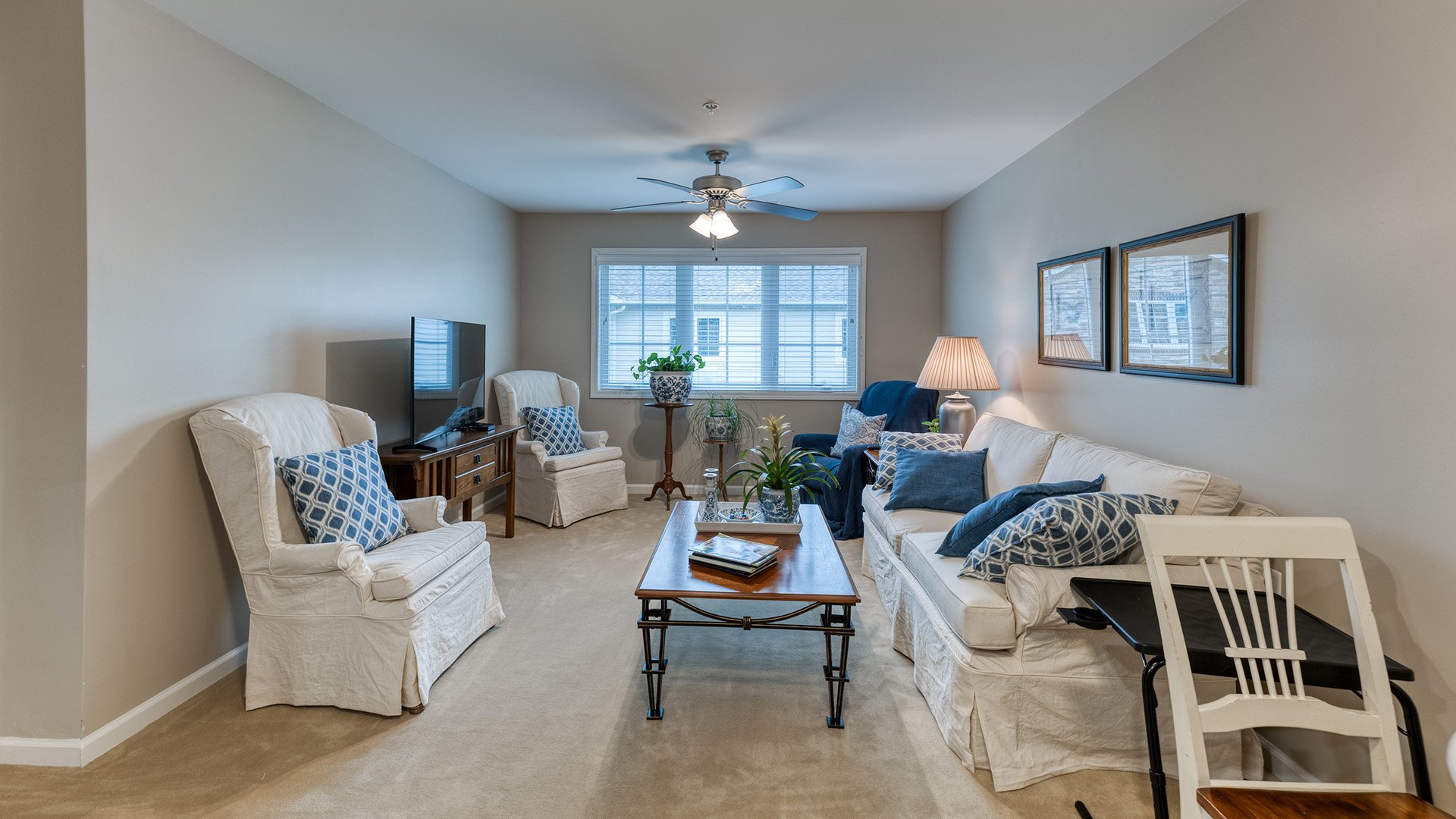 Senior-friendly apartment living room at Cedarhurst of Jacksonville, offering comfortable and accessible design for residents
