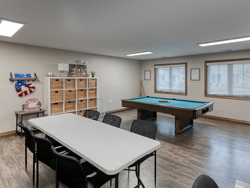 Residents at Cedarhurst of Jacksonville enjoy a dedicated activity room, offering an accessible space for hobbies, crafts, and games