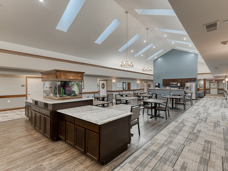 An inviting common area at Cedarhurst of Jacksonville, featuring a tranquil fish tank for residents to enjoy