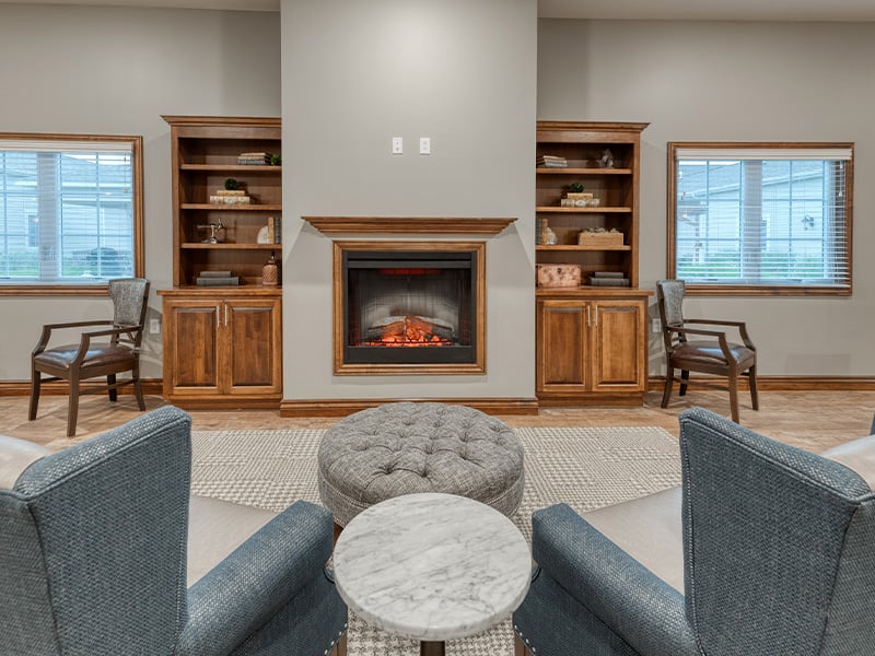 A spacious and inviting common area at Cedarhurst of Jacksonville, designed for connection with comfortable seating for residents across all living options