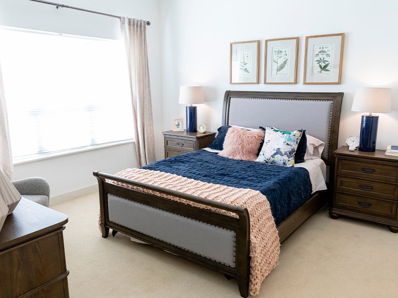 Bedroom of a senior apartment at Cedarhurst of La Vista, designed for comfort and personalization