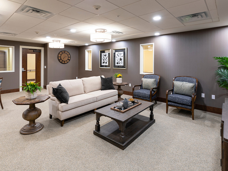 A comfortable common area at Cedarhurst of La Vista, featuring plush seating for residents to relax