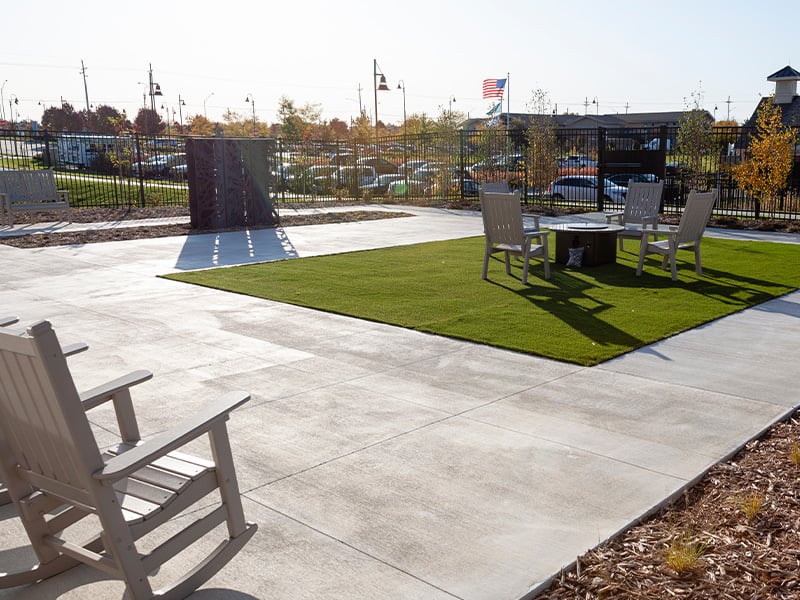 Versatile outdoor patio, featuring dining tables, and conversational seating