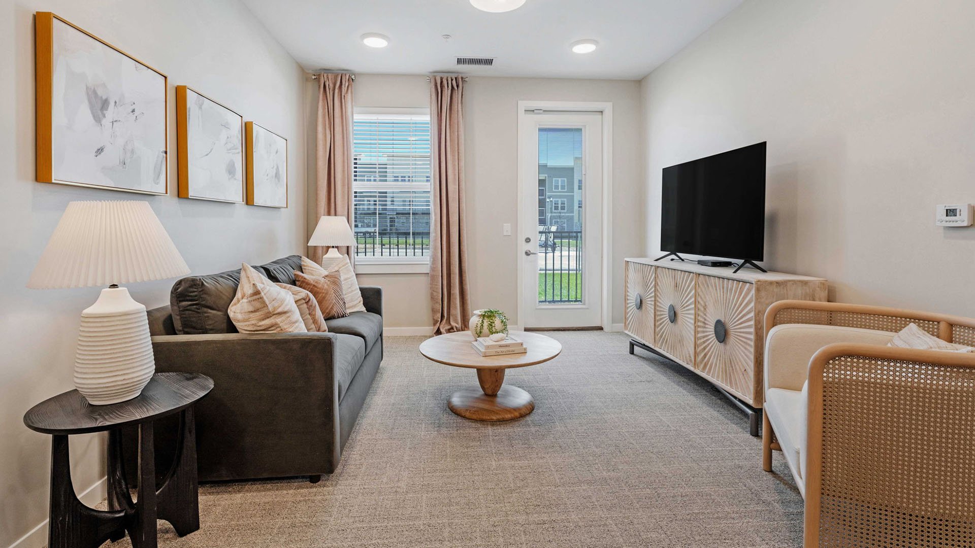Senior-friendly apartment living room at Cedarhurst of Lawrence, offering comfortable and accessible design for residents.