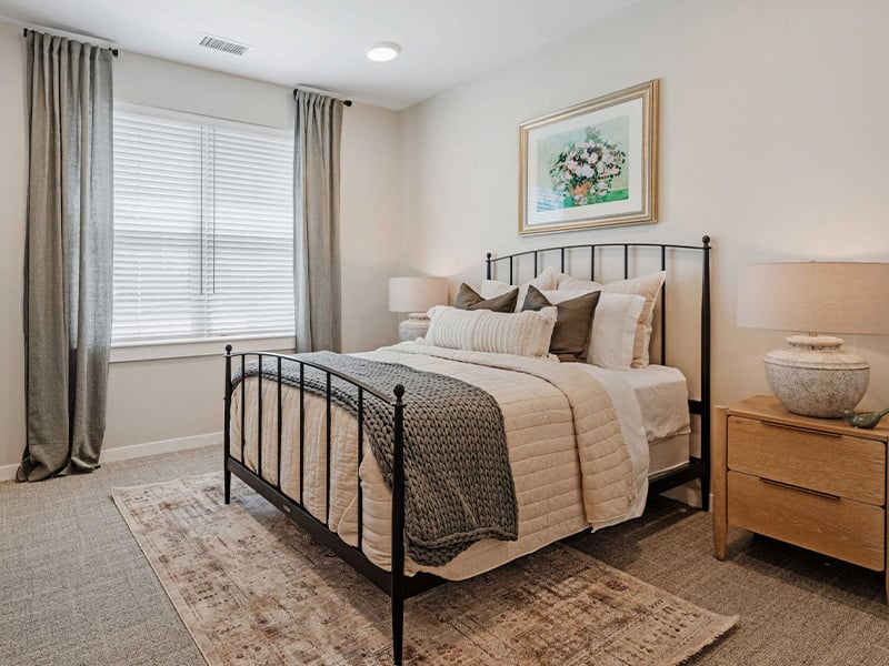 Bedroom of a senior apartment at Cedarhurst of Lawrence, designed for comfort and personalization