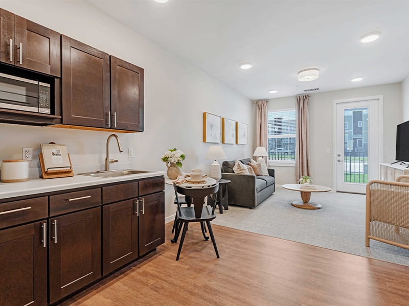 A thoughtfully designed, accessible kitchenette in a senior apartment at Cedarhurst of Lawrence