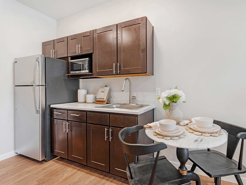 An accessible kitchenette in a senior apartment at Cedarhurst of Lawrence, designed for ease of use and independence