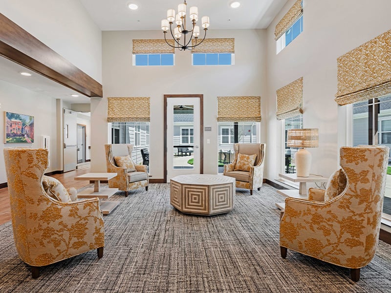 A welcoming common area at Cedarhurst of Lawrence, featuring ample seating