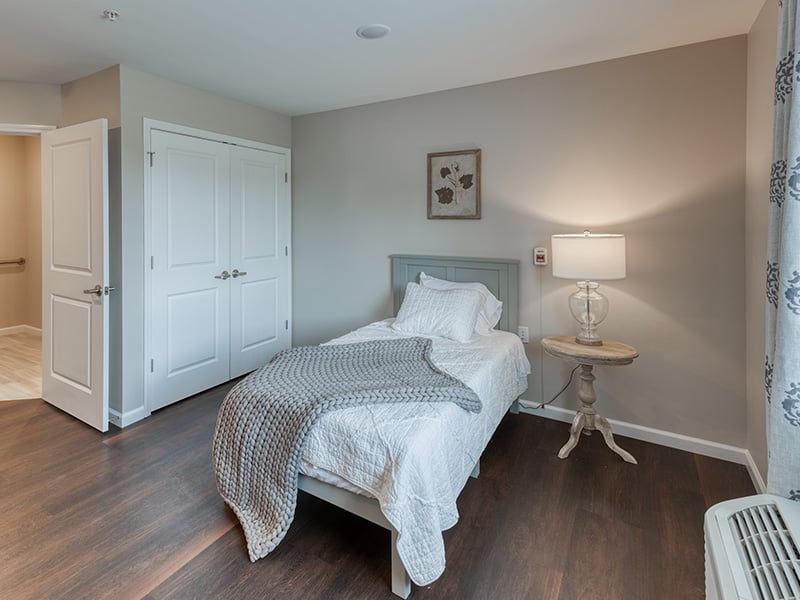 Cedarhurst of Lebanon: A cozy and well-appointed senior apartment bedroom for residents.