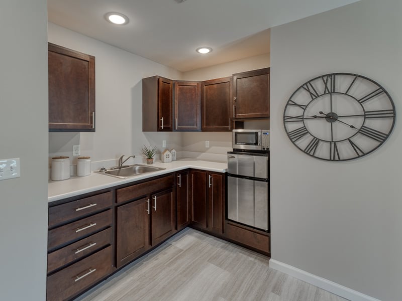 An accessible kitchenette in a senior apartment at Cedarhurst of Lebanon, designed for ease of use and independence.