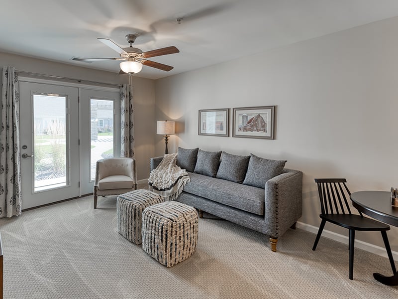 Senior-friendly apartment living room at Cedarhurst of Lebanon, offering comfortable and accessible design for residents.
