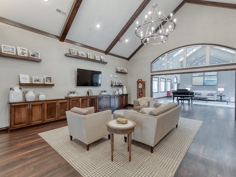 A welcoming common area at Cedarhurst of Lebanon, featuring ample seating and a television, perfect for relaxation or watching programs