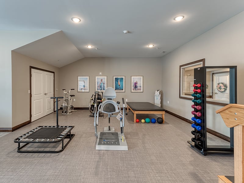 The dedicated physical therapy room at Cedarhurst of Lebanon, equipped with accessible equipment for resident rehabilitation and wellness