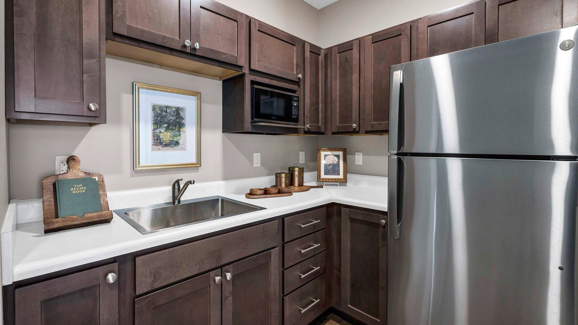 An accessible kitchenette in a senior apartment at Cedarhurst of Lincoln, designed for ease of use and independence