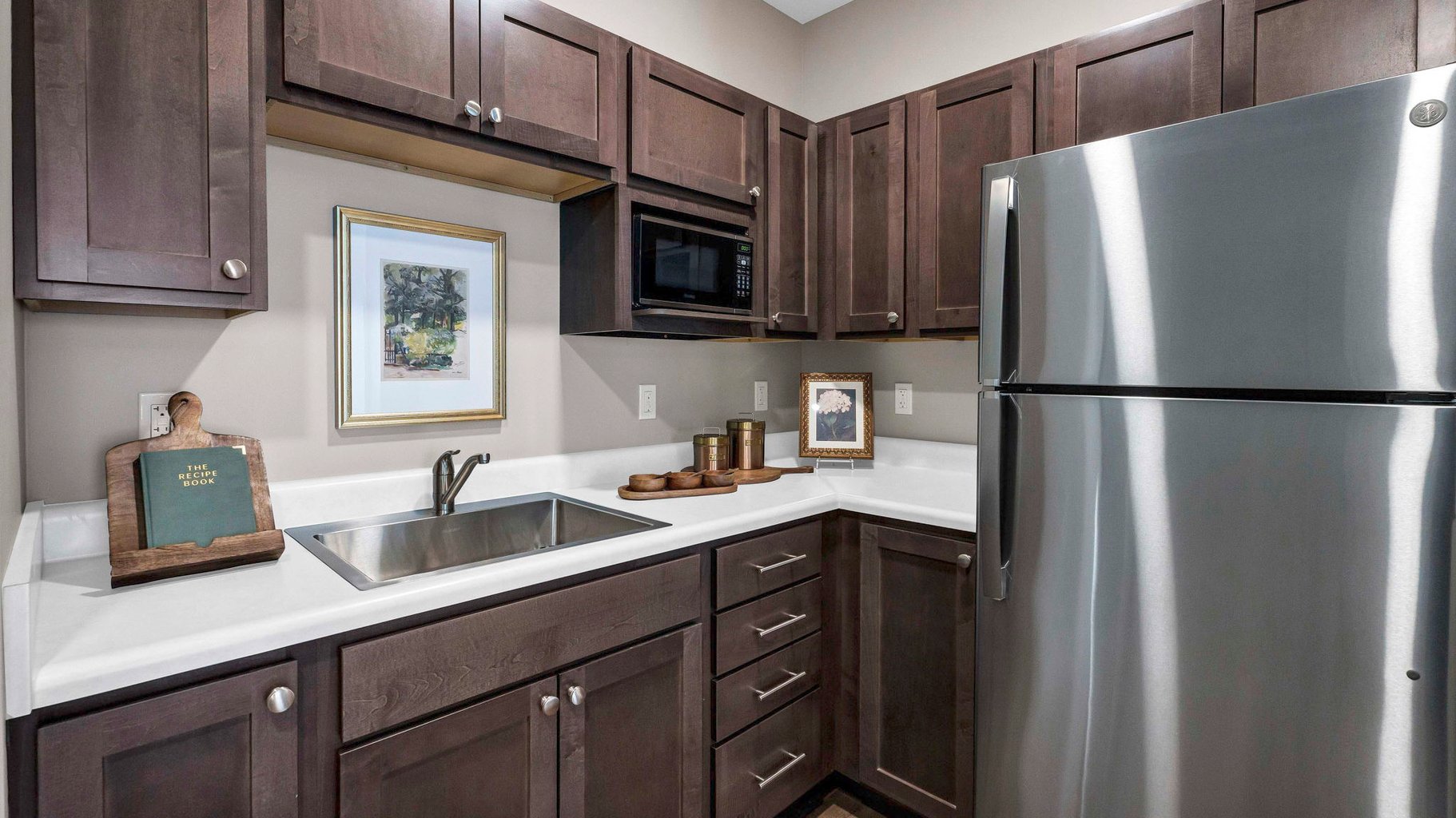 An accessible kitchenette in a senior apartment at Cedarhurst of Lincoln, designed for ease of use and independence