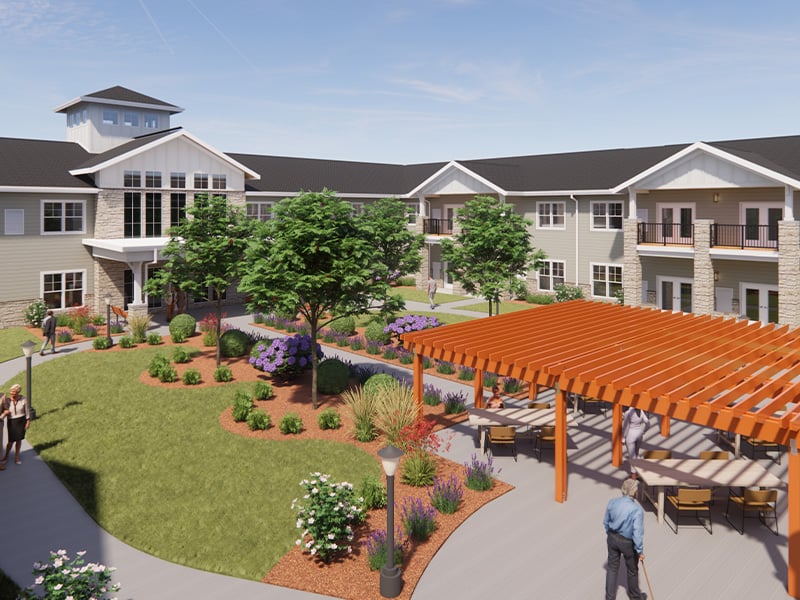 Outdoor green space at Cedarhurst of Lincoln with paved walking paths, a wooden pergola, and fireplace