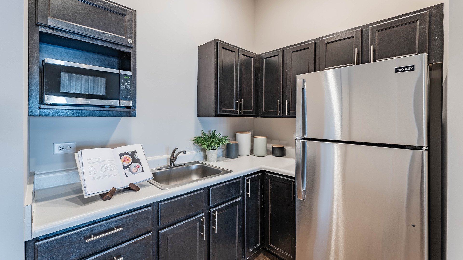 An accessible kitchenette in a senior apartment at Cedarhurst of McHenry, designed for ease of use and independence.