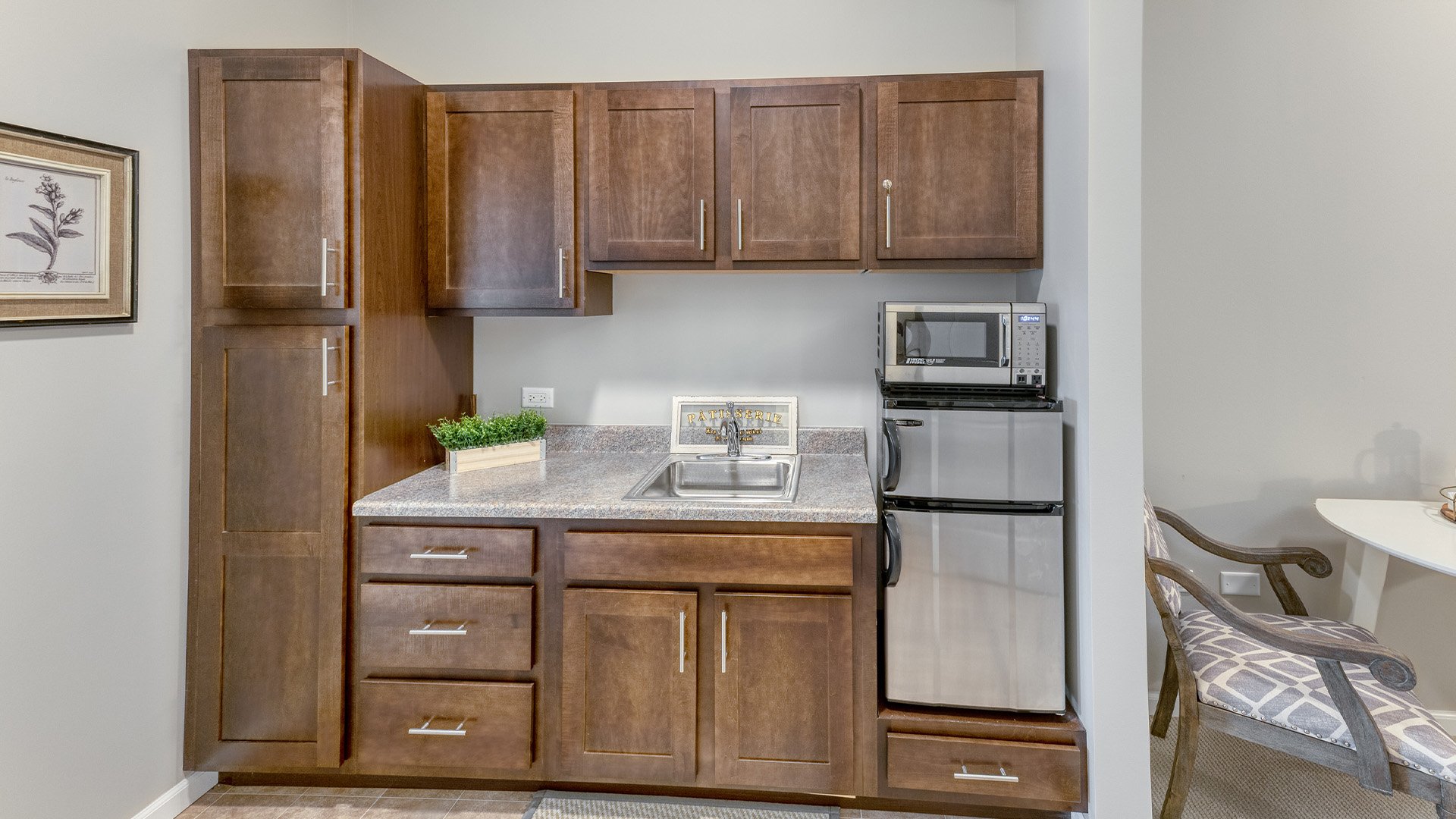 An accessible kitchenette in a senior apartment at Cedarhurst of Naperville, designed for ease of use and independence.
