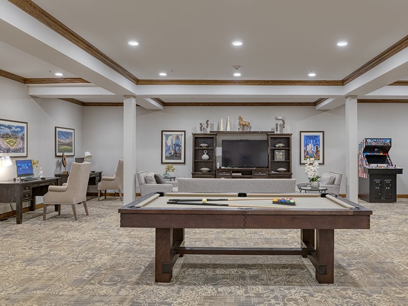 Residents can enjoy a friendly game of pool in the well-equipped game room at Cedarhurst of Naperville.